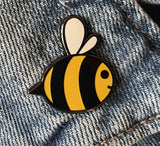 bumble bee pin badge on denim jacket